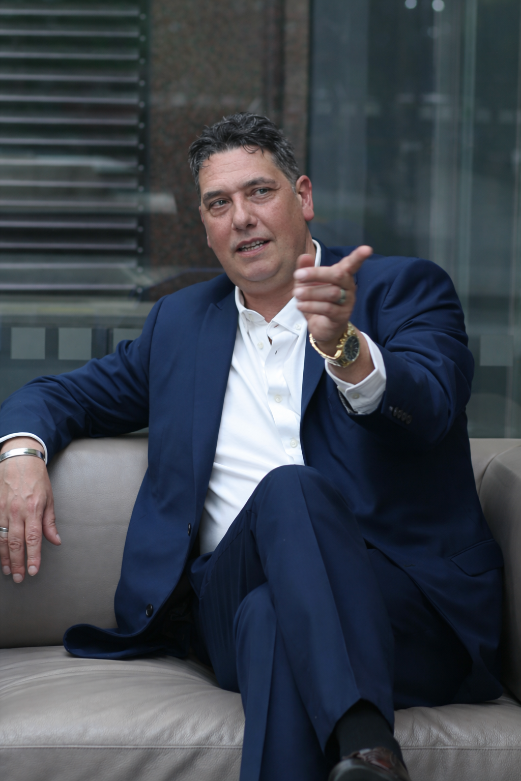 Author Elliott King holding a copy of his book Marketing Wins